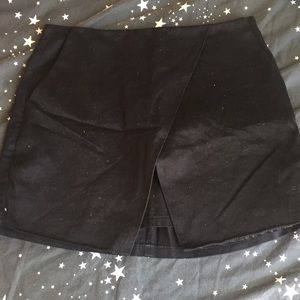 Black asymmetrical mini skirt
